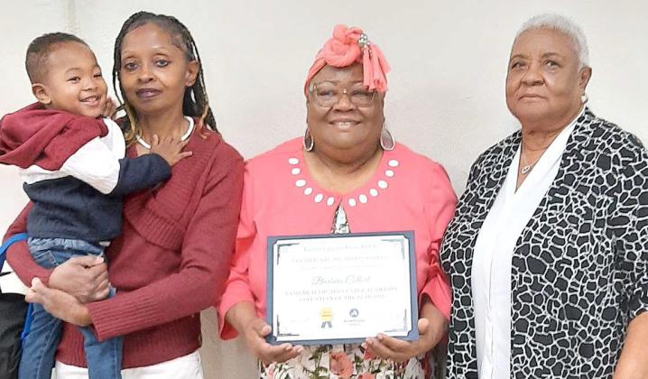 Barbara Colbert received award for 278 volunteer hours from Runningwater Draw RSVP. With her were her daughter Kia Bolding, great grandson Carter Taylor, and her cousin Rose Nunley.