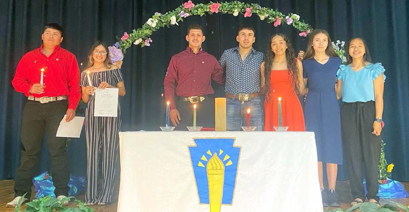 Members of the National Honor Society were inducted into the Horace Mann Chapter of the National Honor Society during a special ceremony Wednesday afternoon, May 8, 2024, in the Amherst School Auditorium. New members on the far left, holding a candle and a certificate, are Oscar Medrano and America Pacheco. Existing members (left to right) are Kevin Garcia, Hector Perez, Dennys Reyes, Yadira Contreras, and Maricella Gonzalez. (Submitted Photo)