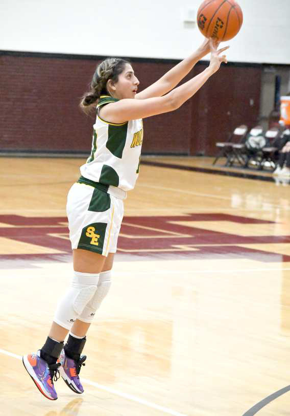 FIRING THE THREE- Springlake-Earth senior, Halee Toscano, fires up a three from the right elbow, during the first half of the Lady Wolverines’ bi-district contest with Wildorado on Tuesday. The Lady Wolverines came up short in the contest, as their season came to an end in Hereford. (Staff Photo by Derek Lopez)