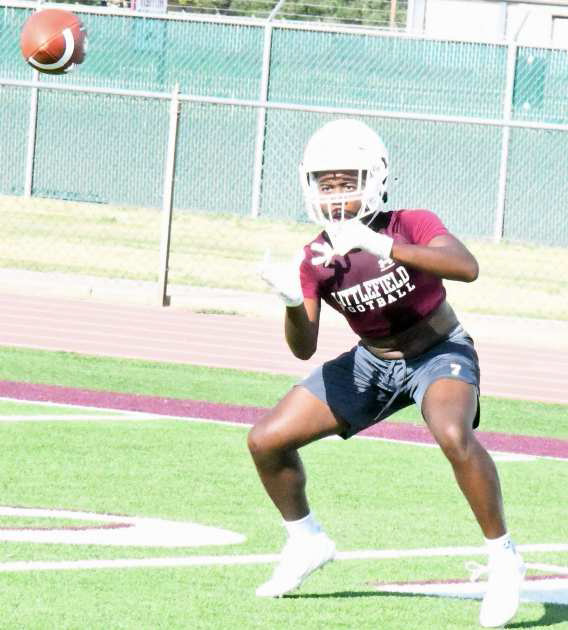 Littlefield’s Eizeah Coleman catches a ball and gets in and out of his route, during their first day of two-a-day practice at Wildcat Field on Monday. (Staff Photo by Derek Lopez)