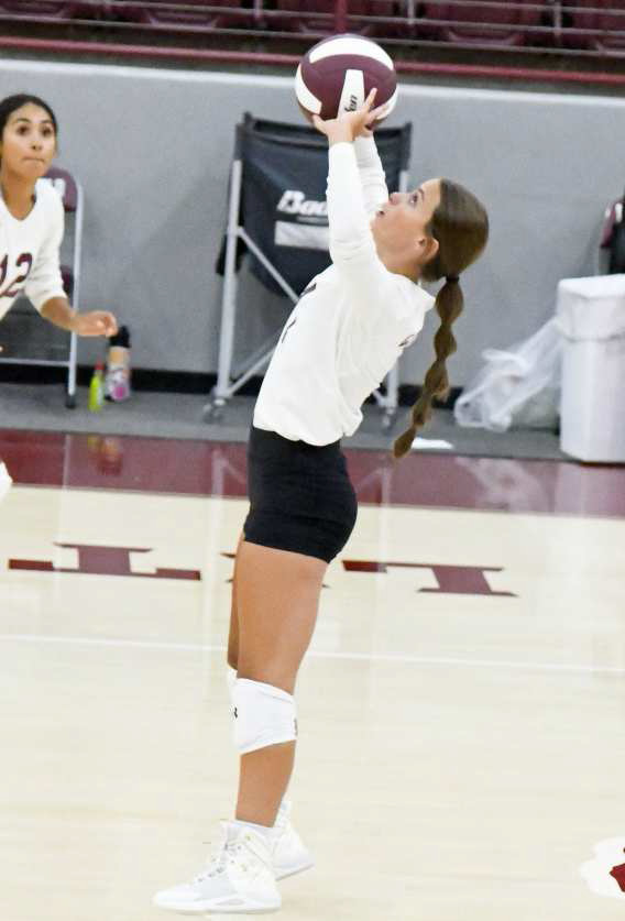 SETTING UP THE ATTACK - Littlefield setter, Bryndle Ray, sets a ball up in the air as the Lady Cats look to strike for a point, during their victory over the Lubbock Titans on Tuesday at Wildcat Gymnasium. (Staff Photo by Derek Lopez)