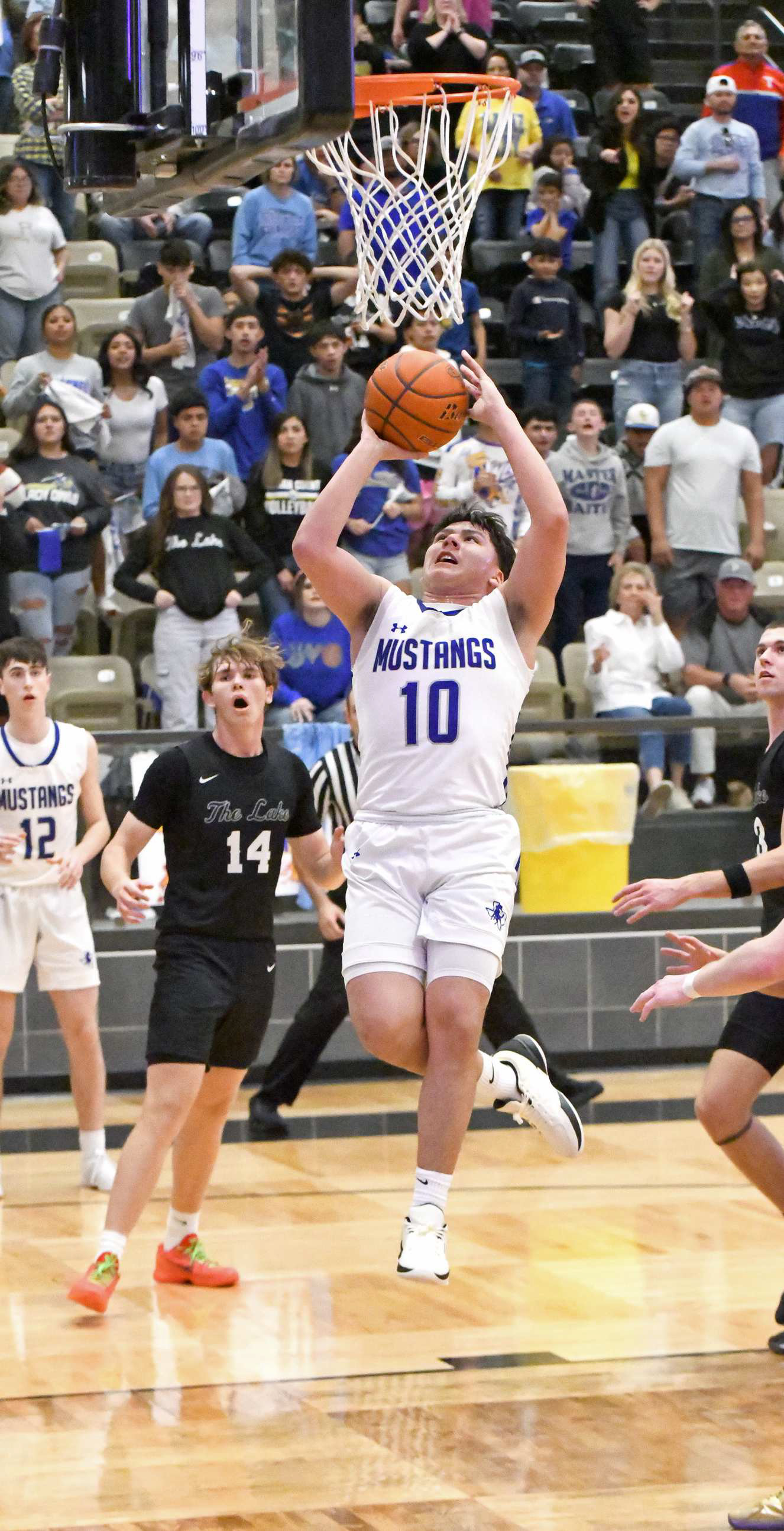 Olton senior, Allen Vasquez ties the game, 45-45, with 1:18 to play in the final quarter of the Mustang’s 2A-DI Regional Semi-Final game against Reagan County in Lamesa on Tuesday. (Staff Photo by Derek Lopez)