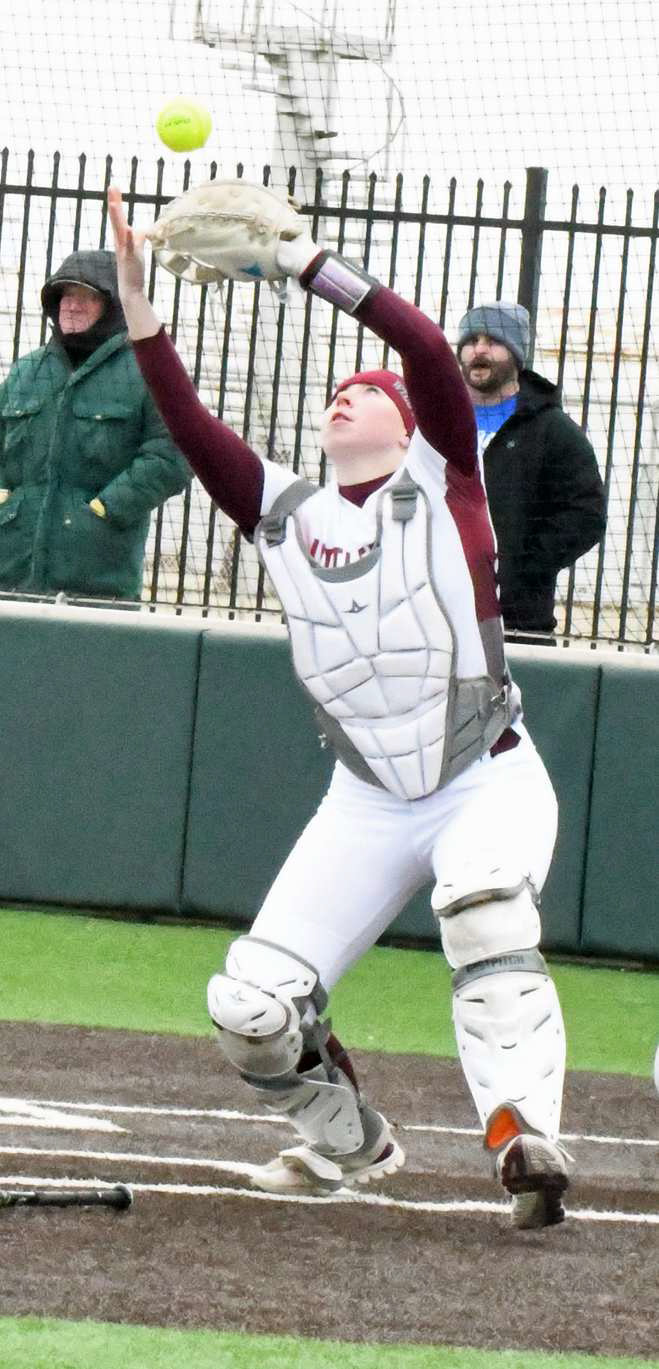 Senior catcher, Taryn Golden, catches a popped up bunt, during the top of the first inning of the Lady Cats’, 17-3, victory in their seasonopener on Saturday over LCHS. (Staff Photo by Derek Lopez)