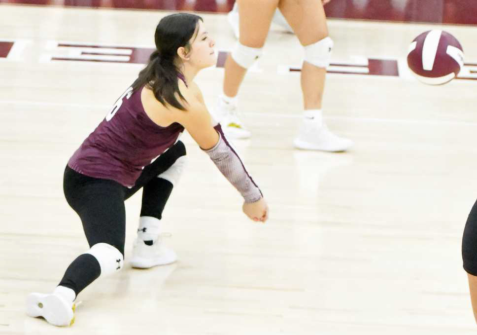 Littlefield libero Madi Brown digs out a ball, during the third set of the Lady Cats’, 3-0, victory over Loop last Saturday at Wildcat Gym. (Staff Photo by Derek Lopez)