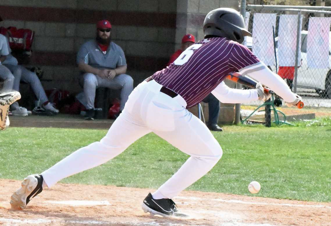 Littlefield senior, Markus Rosales, lays down a bunt on the third-base side and makes it to first on a bobble by the third baseman to make it two runners on for Littlefield in the top of the fourth inning. The Wildcats’ would fall in extra inning to the Mustangs in Denver City on Tuesday, 7-6. (Staff Photo by Derek Lopez)