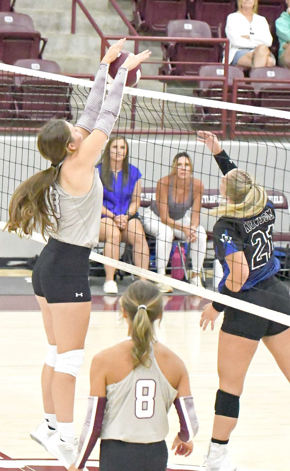 Littlefield’s Maggie McNeese deliveres a block against the Lubbock Titans, during the first set of their match on Tuesday in their home season-opener. (Staff Photo by Derek Lopez)