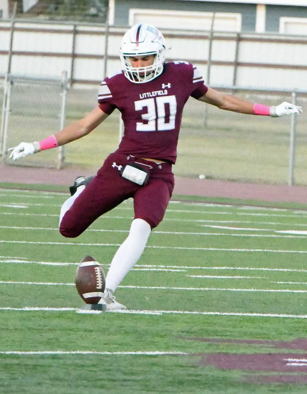 Littlefield senior, Adam MacDonald, boots the opening kick-off down the field, as the Wildcats district match-up got underway with Idalou on Friday night. (Staff Photo by Derek Lopez)
