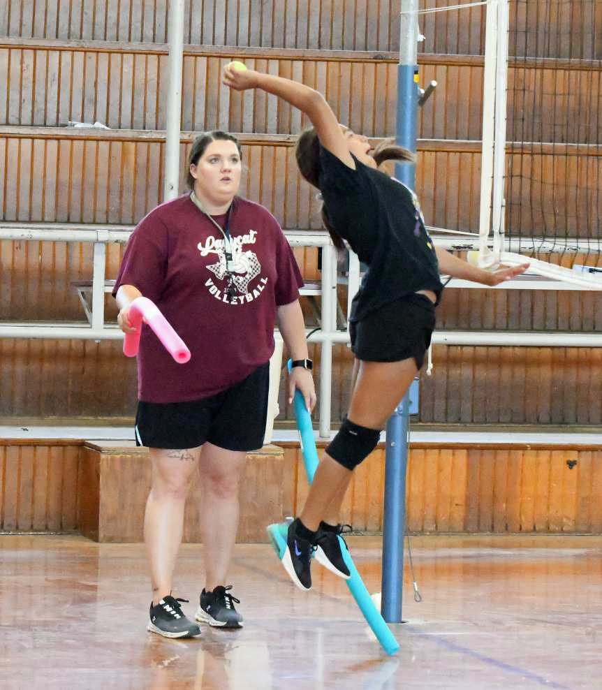 Littlefield Head Volleyball Coach Kaylee Longoria coaches her afternoon camp through drills, during the second day of camp on July 16th at the Junior High Gymnasium. (Staff Photo by Derek Lopez)