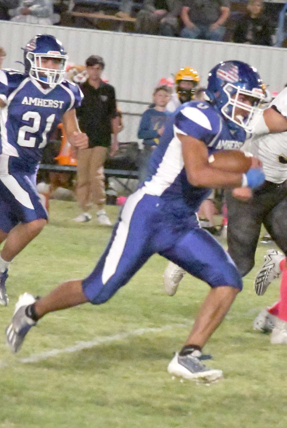 ACCELERATING TO THE END ZONE - Amherst senior, Hector Perez, takes a run up the middle, kicking it into high gear on his way to a long touchdown run, during the second quarter of the Bulldog’s, 56-0, victory over Wellman-Union on Thursday at Bulldog Stadium. (Staff Photo by Derek Lopez)