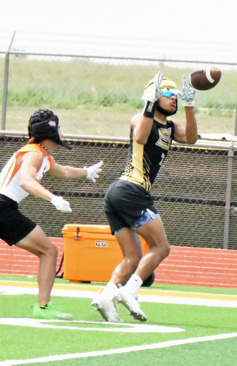 Sudan senior, Jaibryn Ornelas, catches an out route from junior quarterback, Caleb Groetken, during their 7v7 match against Wink in Sudan. (Staff Photo by Derek Lopez)