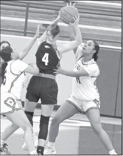 Littlefield’s Nia Cleveland ( 11) and Madison Williams (5) double team Kyndal Grimes, looking for a steal, during the first half of the Lady Cat’s victory over Roosevelt on Wednesday at Wildcat Gym. (Staff Photo by Derek Lopez)
