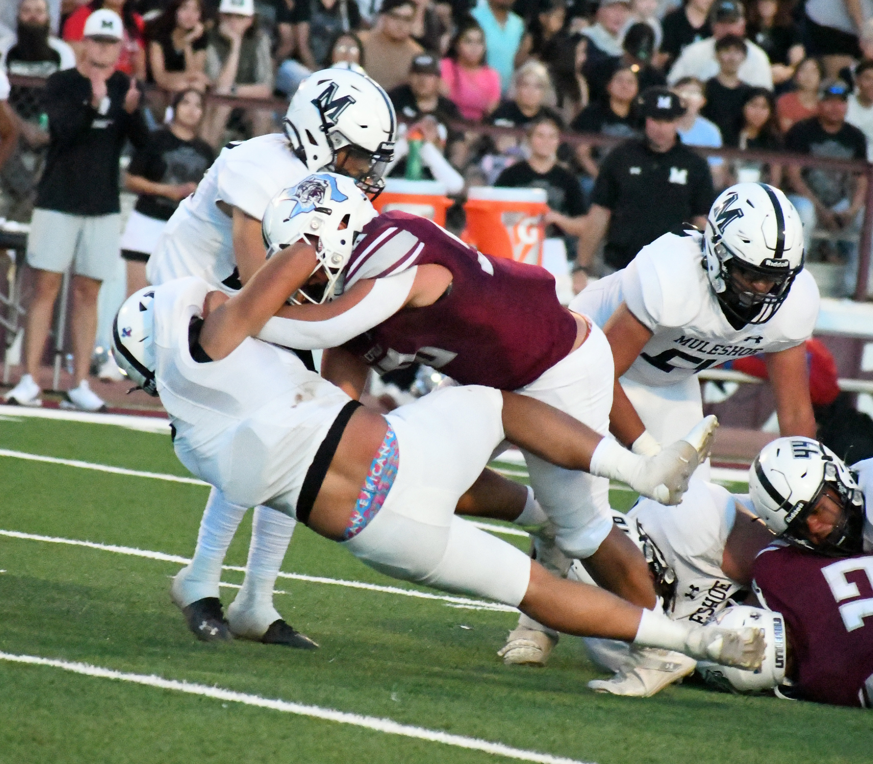 GET THE SYRUP - Littlefield sophomore offensive tackle, Marcquis Rosemond, delivered a pancake block on a Muleshoe defender, during the Wildcats', 28-7, victory over the Muleshoe Mules on Friday night in their home-opener at Wildcat Stadium. (Staff Photo by Derek Lopez)