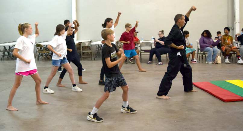 MARTIAL ARTS - Instructor Hutchison McWilliams works with his Little Dragons Class on Tuesday, August. 1st, at Zeke’s, located on Waylon Jennings Ave. (Photo by Ann Reagan)