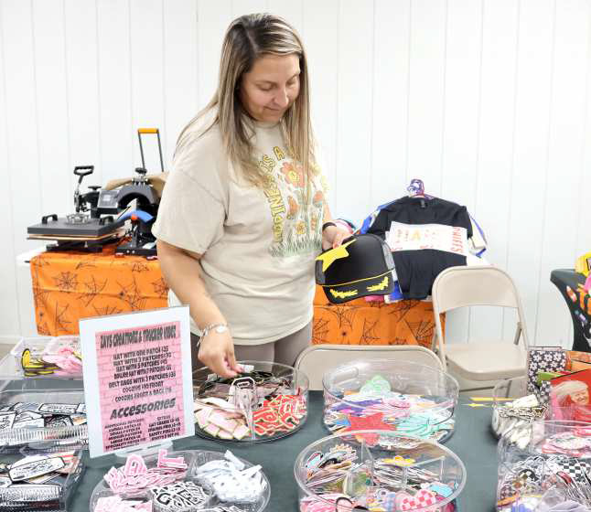 Zays Creationz &amp; Trucker Vibez hat bar by Karina Curiei was at the Littlefield Trade Day to make custom Caps, Boujee hats, Belt Bags, Coozies and more at the Lamb County Ag Center in Littlefield on Saturday, October 12, 2024. (Photo by Ann Reagan)