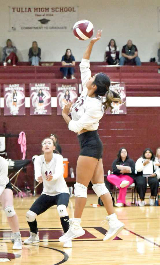 Senior, Amiah Elizondo, goes up for a hit, during the second set of the Lady Cats’, 3-2, victory on the road on Tuesday night over Tulia, keeping their play-off hopes alive. (Staff photo by Derek Lopez)
