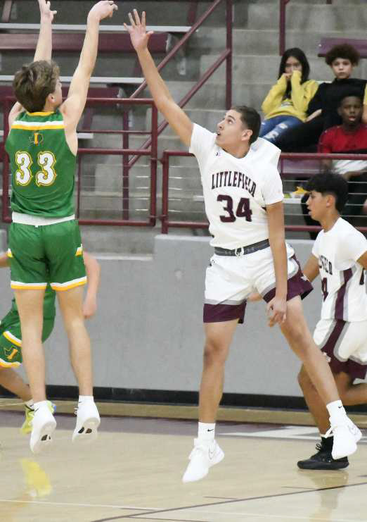 Sir Pratt (34) goes up for a block, altering the shot of Idalou’s Houston Stark, during the first half of the Wildcat’s, 58-52, victory over Idalou in Littlefield on Tuesday. (Staff Photo by Derek Lopez)
