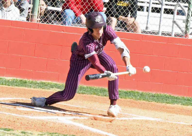 Littlefield senior, Adam MacDonald, lays down a sacrifice bunt in the top of the first inning of the Wildcats, 10-1, victory over Friona on Saturday. (Staff Photo by Derek Lopez)