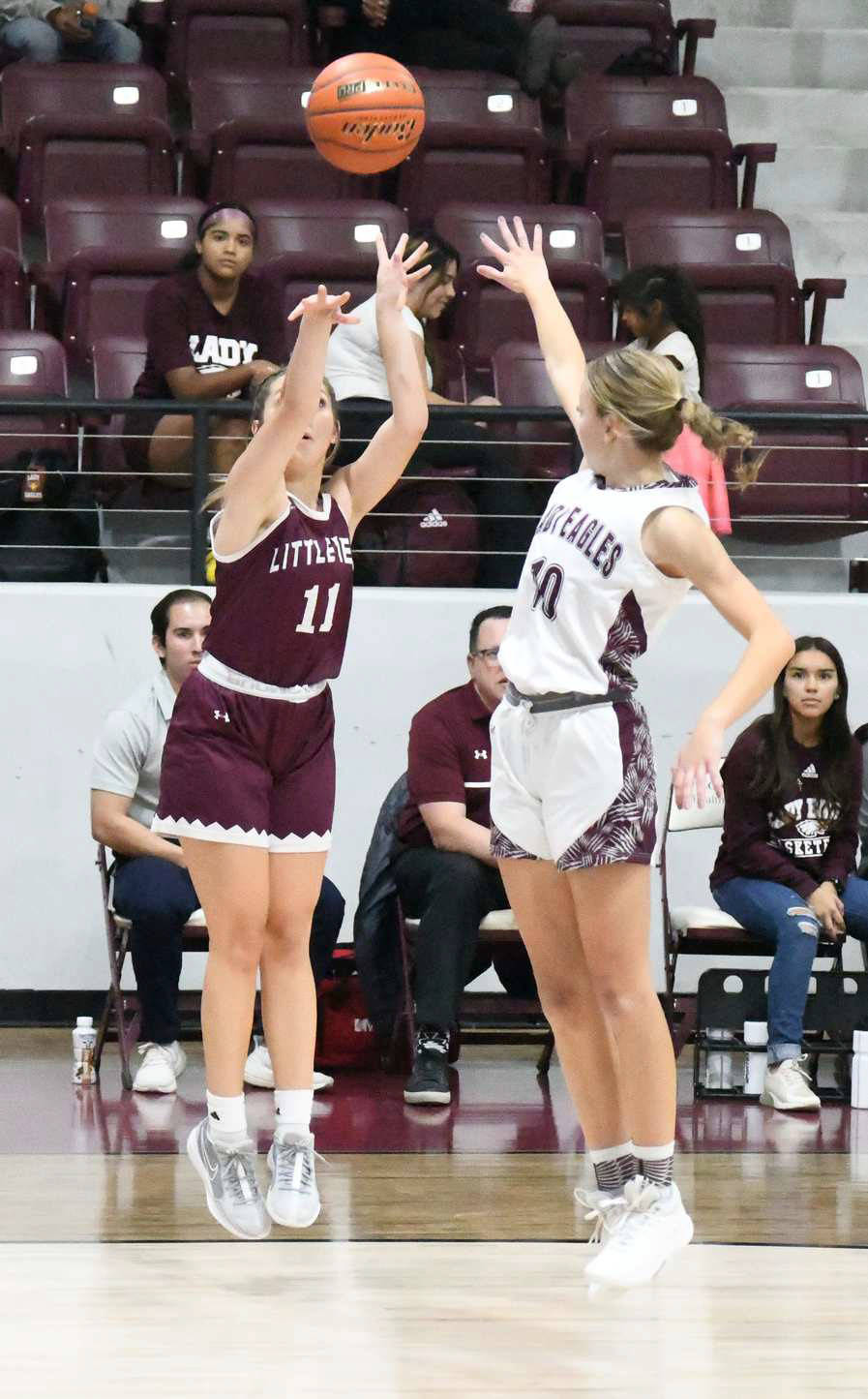 Littlefield junior, Marysa Saenz, fires up a three from the right wing over the outstretched arm of a Lady Eagle’s defender, during the Lady Cats, 56-32, victory on the road last Tuesday at Roosevelt. (Staff Photo by Derek Lopez)