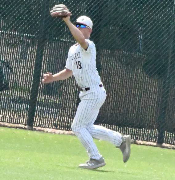 Littlefield center fielder, Bradyn Redman, catches a fly ball in shallow center field for an out, during the top of the seventh inning of the Wildcats, 6-3, victory over the Bobcats on Saturday in their first meeting of District Play. (Staff Photo by Derek Lopez)