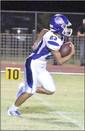 HOUSE CALL - Amherst’s Aiden Rodriguez takes a kick-off 71 yards to the house for a touchdown, during the second half of the Bulldog’s victory over the Wolverines on Friday. (Staff Photo by Derek Lopez)
