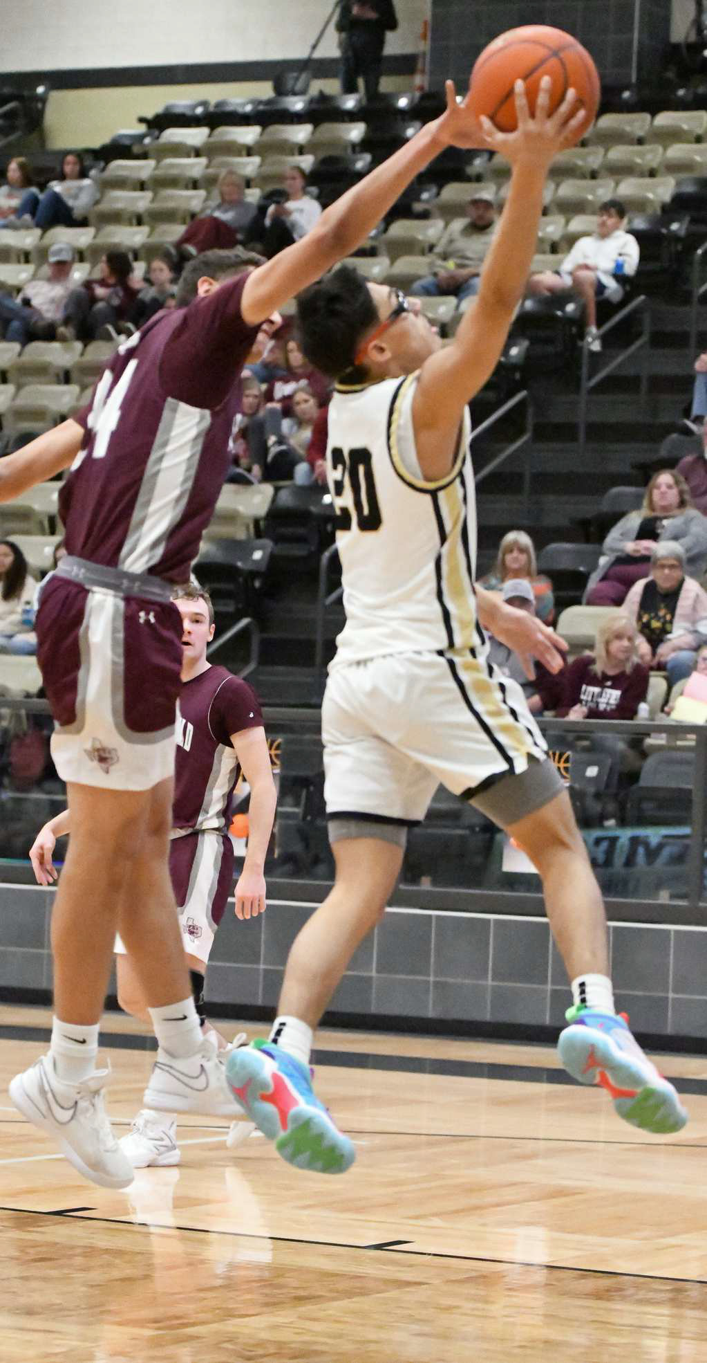 Littlefield senior Sir Pratt (34), goes up and deliveres a block on Lamesa’s Robert Dimas (20), during the first half of the Wildcats, 74-36, road victory on Tuesday against the Golden Tornadoes. (Staff Photo by Derek Lopez)