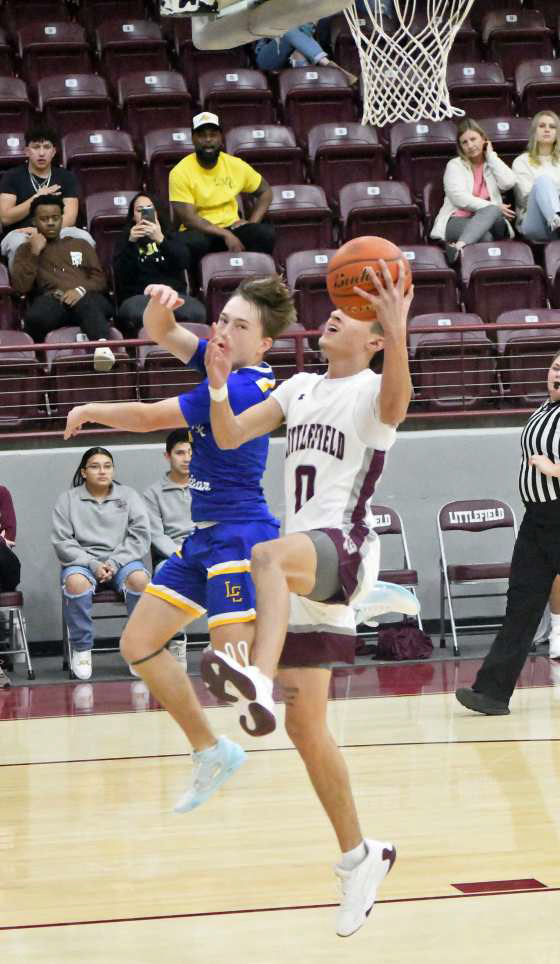 Littlefield’s Omar Martinez (0), gets out on the break and finishes with a reverse lay-up, during the second half of the WIldcats’, 63-55, home victory to close out the pre-district schedule on Saturday. (Staff Photo by Derek Lopez)