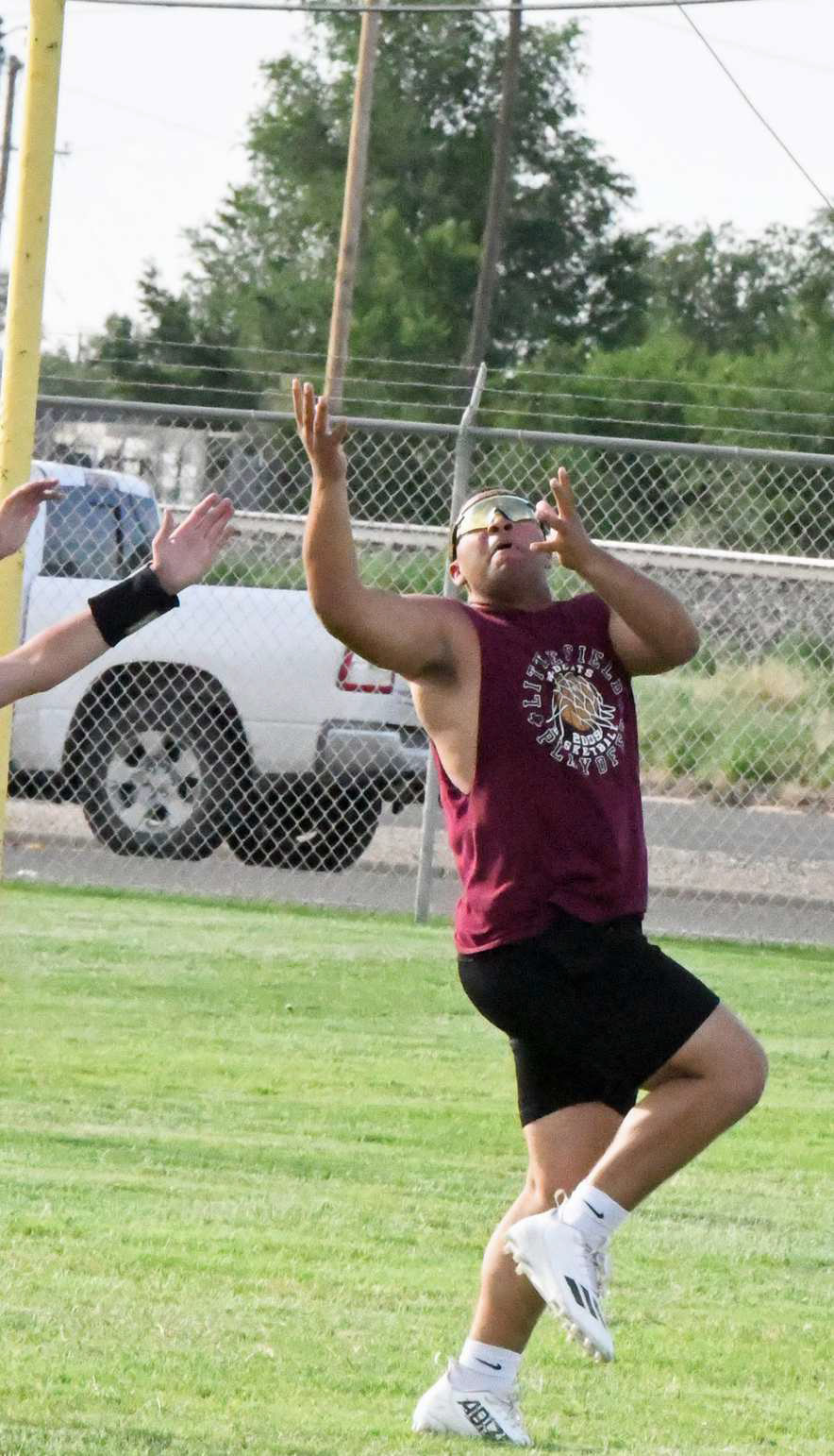 Littlefield’s Marcquis Rosemond catches a touchdown pass from Littlefield JV quarterback Sammy Saenz, during the first night of 7v7 at Wildcat Field last Monday. (Staff Photo by Derek Lopez)