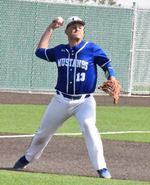 THROWINGACROSS FOR THE OUT - Olton third baseman, Paul Lopez, fields a grounder at third and fires it across the diamond to first for an out, during the bottom of the first inning of the Mustang’s seeding game against New Deal on Monday in Littlefield. (Staff Photo by Derek Lopez)