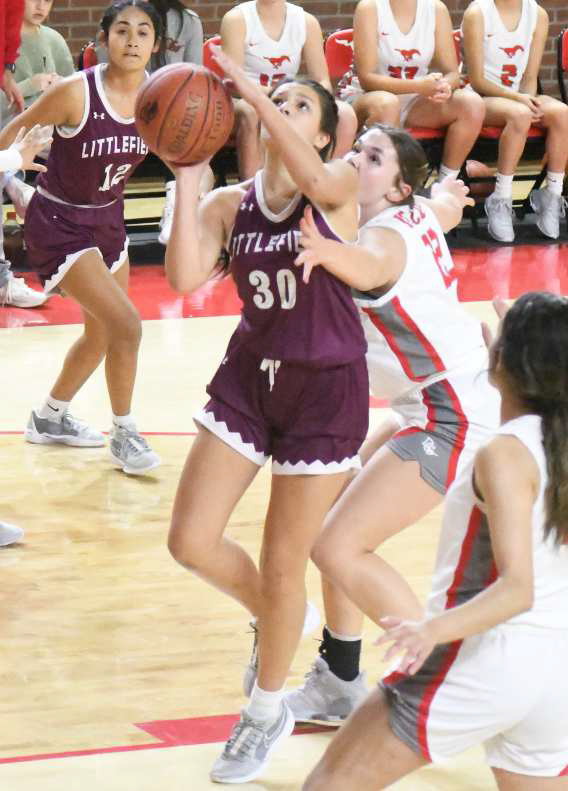 Littlefield junior, Ari Castillo, gets into the paint for a lay-up, during the first half of the Lady Cats’, 47-41, victory over the Denver City Fillies to open district play on Tuesday. (Staff Photo by Derek Lopez)