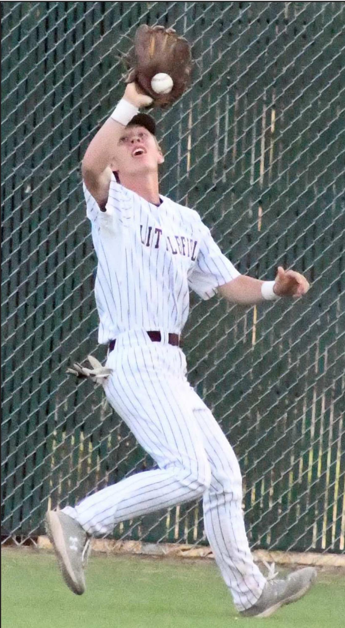 TRACKING THE BALL – Littlefield freshman center fielder, Major McNeese, tracks down a ball in deep center field for an out, during the top of the fourth inning of the Wildcats’, 9-2, victory over Lamesa on Tuesday at Wildcat Field. (Staff Photo by Derek Lopez)