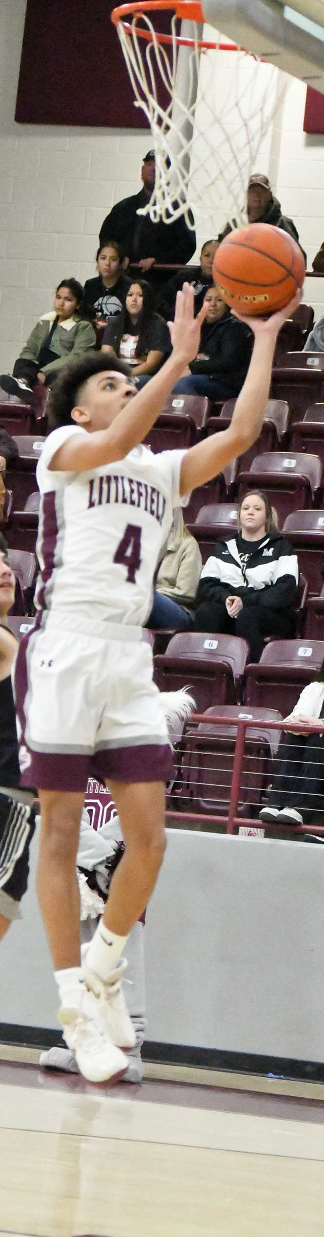 Littlefield junior, Kam McCarty (4), beats the defense for a lay-up, during the second half of the Lady Cats’ victory over Muleshoe on Friday. (Staff Photo by Derek Lopez)