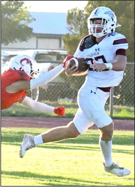 IN FOR SIX - Littlefield junior tailback, Major McNeese, fights his way into the endzone, breaking a Brownfield arm-tackle, during the first quarter of the Wildcats road victory last Friday to close out the pre-district schedule. (Staff Photo by Derek Lopez)