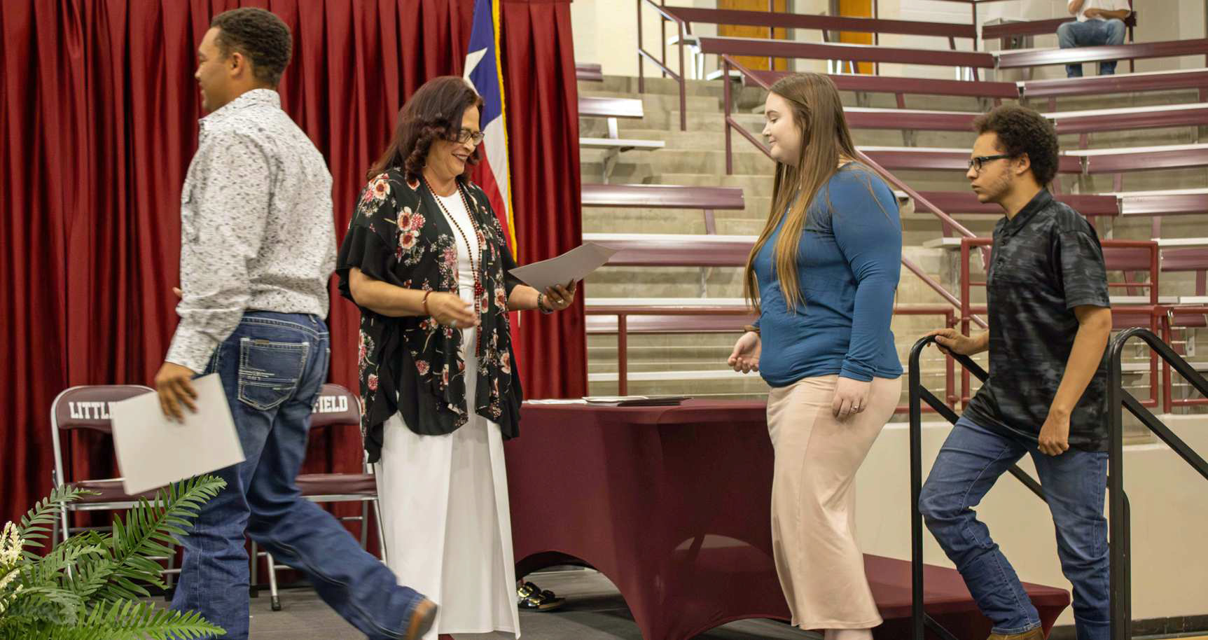 Marcquis Rosemond, Emily Hitchcox and Trent Tisdale accept their $1,000 Food King Scholarship at the Littlefield High School Scholarship Awards Ceremony on May 20, 2025. Other recipients of this scholarship included T’Aijae Chambers, Adam MacDonald, Brianna Martinez, Aidan Tellez and Trishtin Vargas. (Staff Photo by Madison Vidales)