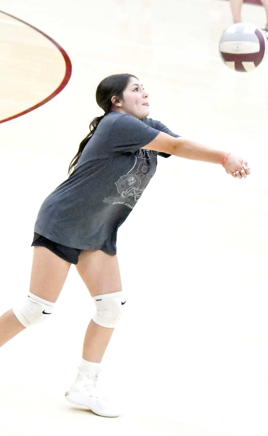Yazmin Longoria gets under a ball during drills at the Lady Cat’s first day ot two-a-day practices on Monday at Wildcat Gymnasium. (Staff Photo by Derek Lopez)