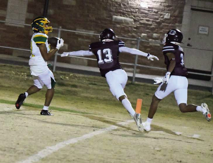 Springlake-Earth’s Kaylob Frietze, catches a touchdown pass from Froylan Agundiz, during the Wolverines, 75-58, loss to Booker in the Class 1A-D1 Bi-district round of the football play-offs on Friday night at Boys Ranch. (Staff Photo by Derek Lopez)