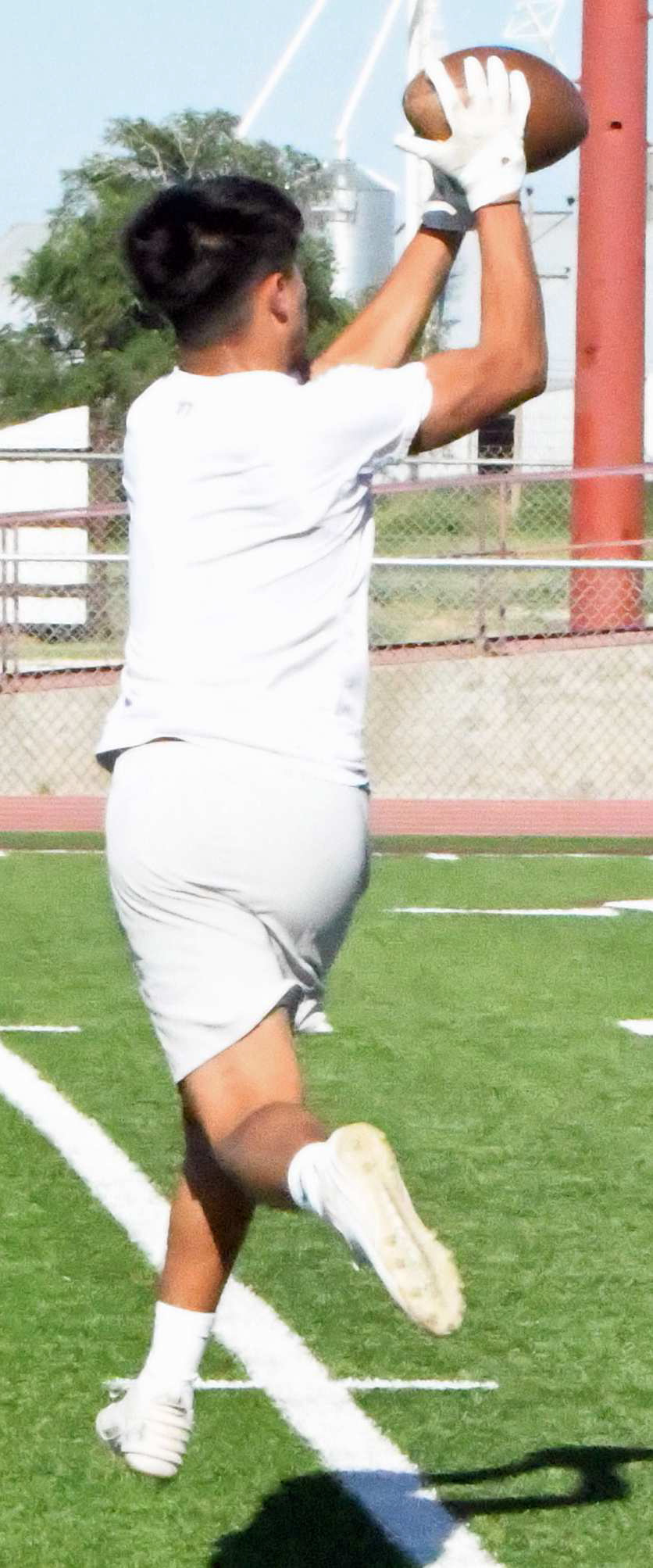 Littlefield’s Gabriel Villanueva catches a touchdown pass from Nate Castaneda, during the Wildcats’ 7v7 match against Abernathy on Monday. (Staff Photo by Derek Lopez)