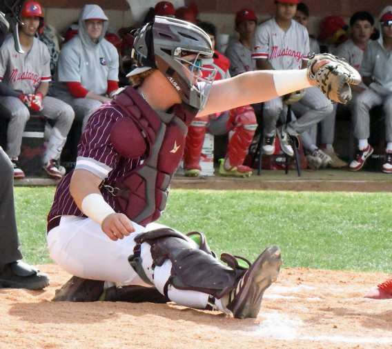 Littlefield catcher, Brenden Bowman, receives a pitch from pitcher, Isaiah Rodriguez, during the Wildcats’ extra inning loss to the Mustangs in Denver City on Tuesday. (Staff Photo by Derek Lopez)