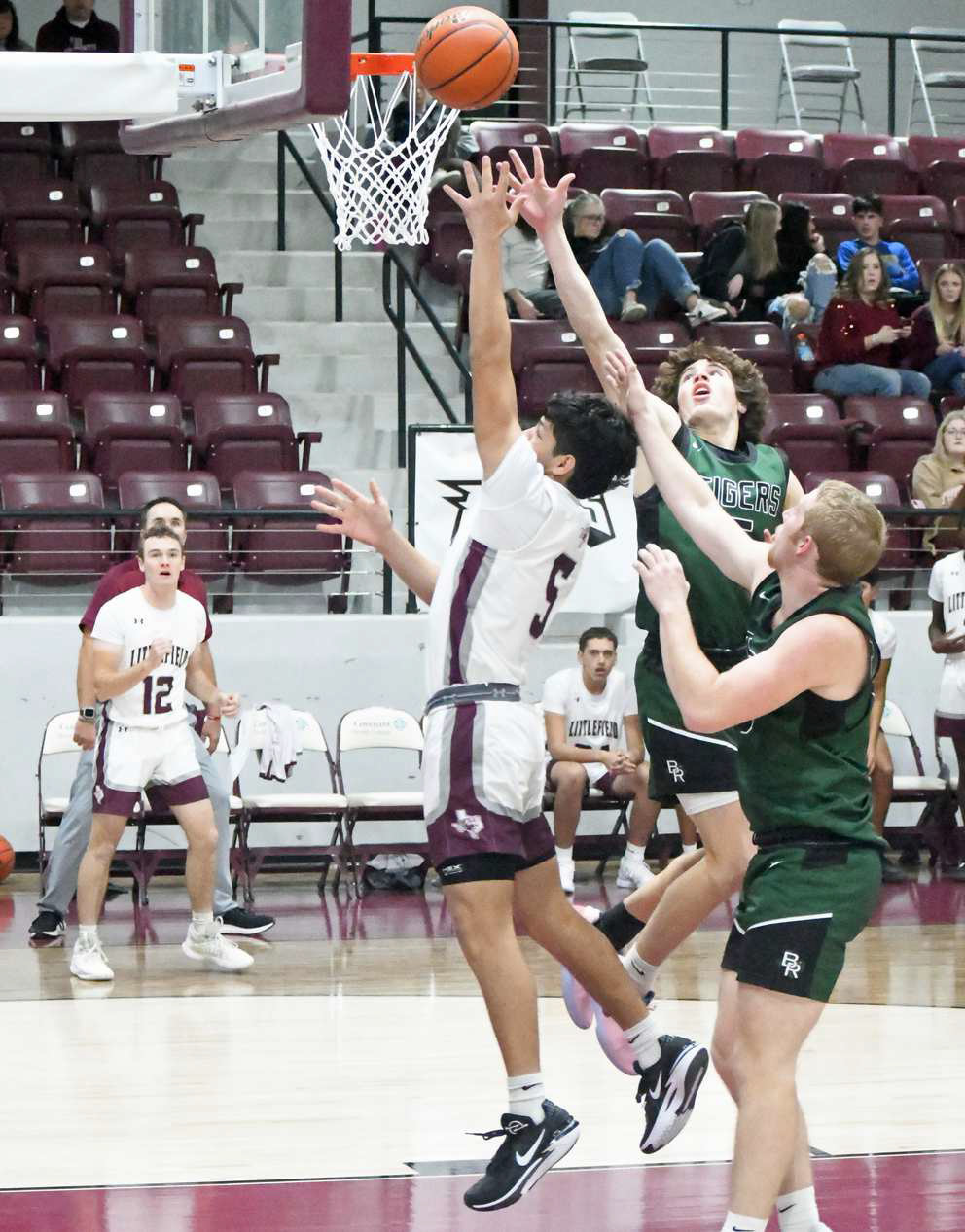 Littlefield senior, Jeremiah Trevino (5), beats the Blue Ridge defense to the basket as he goes up for a lay-up, during the second half of the Wildcats, 52-41, victory over the Tigers in the Roosevelt Tournament Championship. (Staff Photo by Derek Lopez)