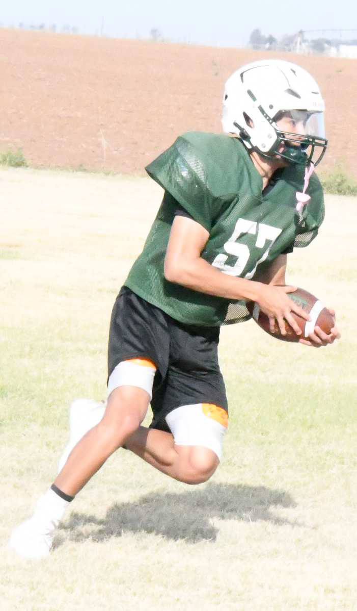 PUTTING IN WORK - The Springlake-Earth Wolverines were hard at work Thursday morning working to sharpen their offense, during their morning practice. The season opens on August 25th, at home against Whitharral at 7:30 p.m. (Staff Photo by Derek Lopez)