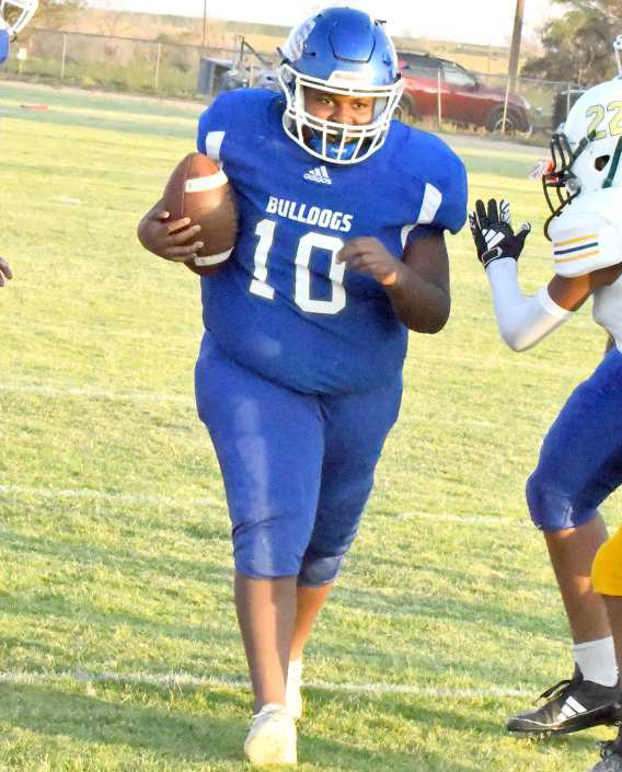 Amherst freshman, Dakari Lee, scores a one-yard touchdown on Thursday, during the Bulldog’s game against Springlake-Earth’s JV. The Bulldogs won the contest, 52-6. (Staff Photo by Derek Lopez)