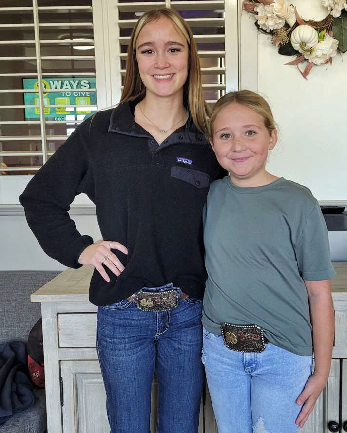 Kealee Bussey, left, competed in the Senior Age Group and Cayton Redman, right, competed in the Junior Age Group at the District 2 Pistol Shooting Competition on Nov. 7, 2024. Both won a custom belt buckle for ther performance. (Submitted Photo)