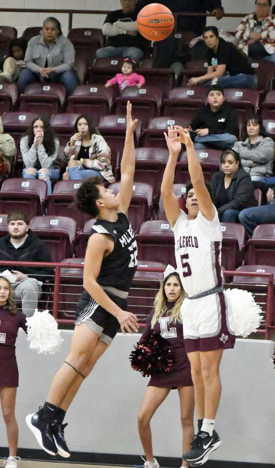 Littlefield senior, Jeremiah Trevino (5), hits a step-back three from the left corner over a Muleshoe defender to close out the third quarter of the Wildcats, 53-42, home victory over the Mules on Friday at Wildcat Gym. (Staff Photo by Derek Lopez)