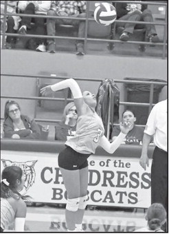 Littlefield sophomore, Madison Williams, goes up to deliver a hit, during the first set of the Lady Cat’s road loss to Childress on Tuesday night. (Staff Photo by Derek Lopez)