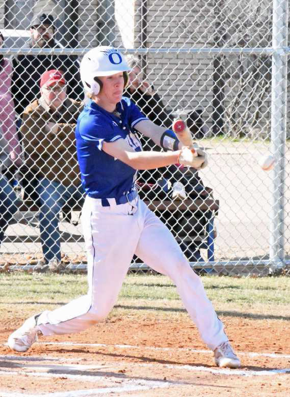 Olton senior, Cole Montgomery, executes a hit and run in the bottom of the first inning, to put two runners on for the Mustangs in their game against Clarendon last Saturday at Mustang Field in Olton. (Staff Photo by Derek Lopez)