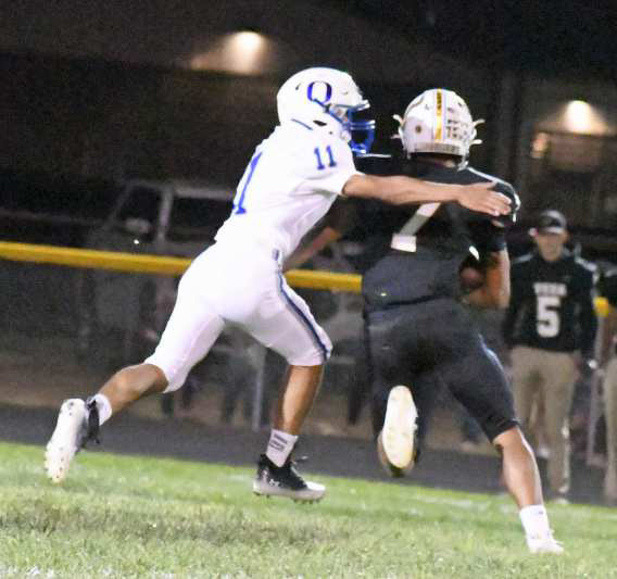 WRAPPING UP - Olton linebacker, Jason Granillo (11), makes a tackle on Vega’s Joaquin Segovia, during the second half of the Mustangs, 21-13, loss to the Longhorns on Friday to close out predistrict play. (Staff Photo by Derek Lopez)
