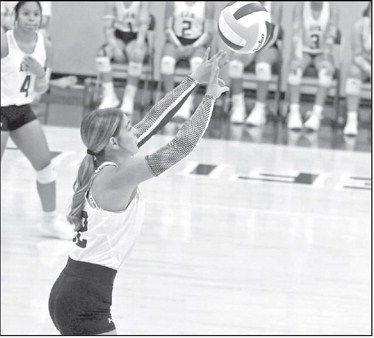 Littlefield’s Mattie Seymore pushes a ball over the net, during the first set of the Lady Cat’s, 0-3, loss to Idalou on Tuesday in their district-opener at Wildcat Gym. (Staff Photo by Derek Lopez)