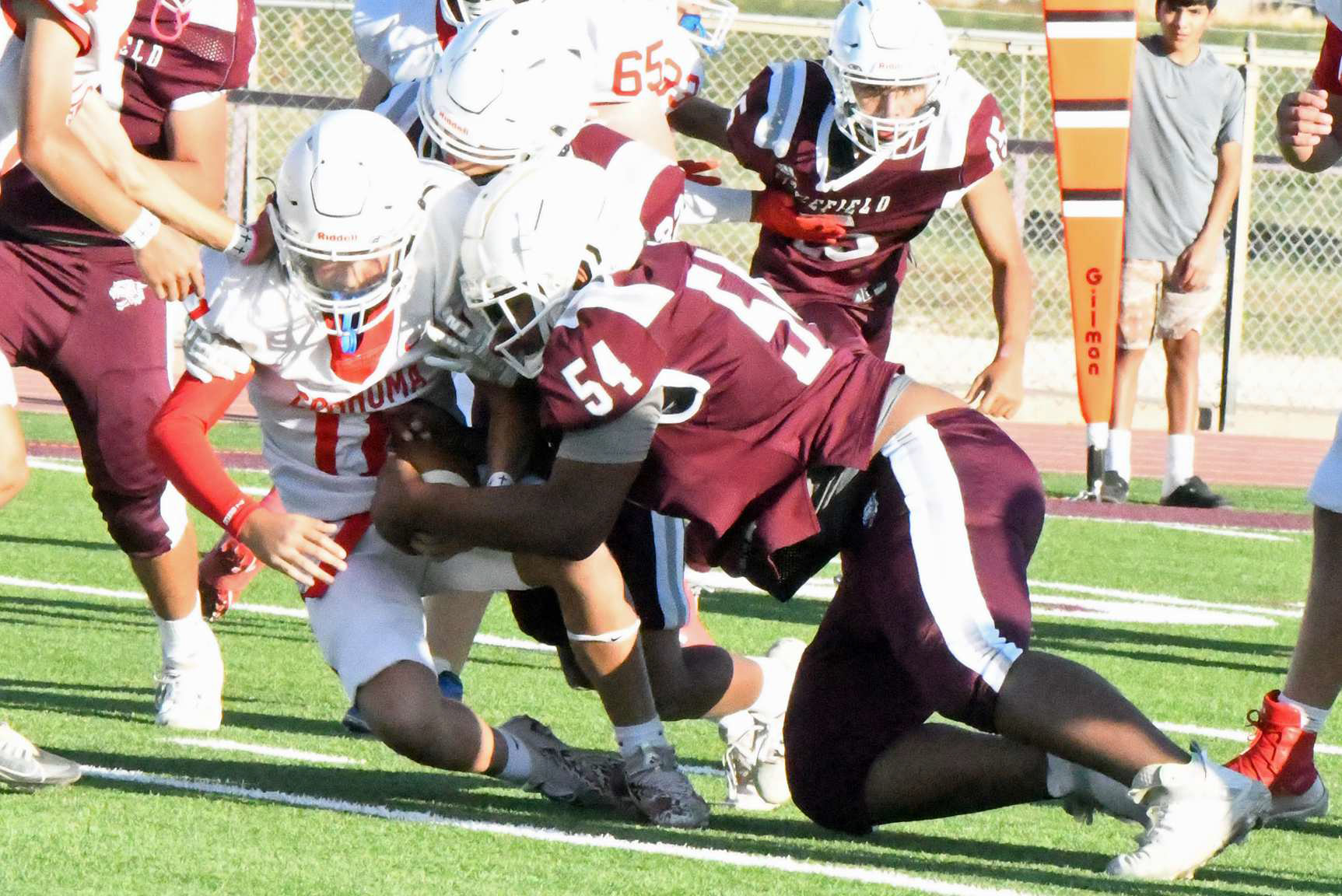 Littlefield’s James Lockridge (54), makes a tackle in the backfield for the Wildats, during the first half of their, 44-6, victory on Thursday at Wildcat Stadium. (Staff Photo by Derek Lopez)