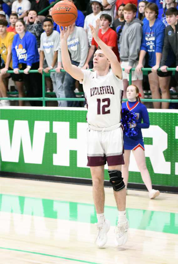 Littlefield junior, Chip Green, drains a three from the left wing, during the second half of the Wildcats’ Area Championship game against Childress on Friday at Floydada High School to put him over 1,000 career points. He finished his junior year with a career mark of 1,003 points. (Staff Photo by Derek Lopez)