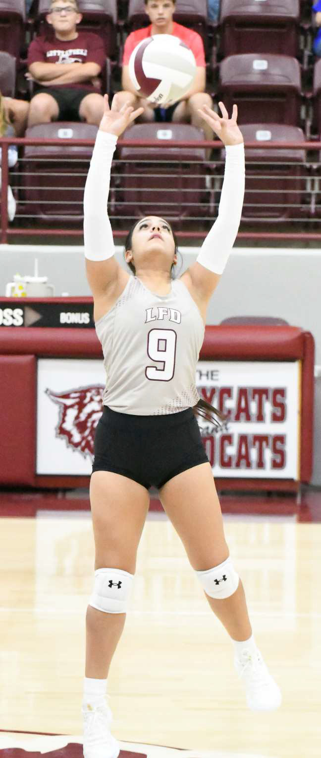 Littlefield’s Kamila Silveira sets a ball up in the air, as the Lady Cats look to go on the attack, during the first set of the Lady Cats’ match against Estacado on Tuesday at Wildcat Gym. (Staff Photo by Derek Lopez)