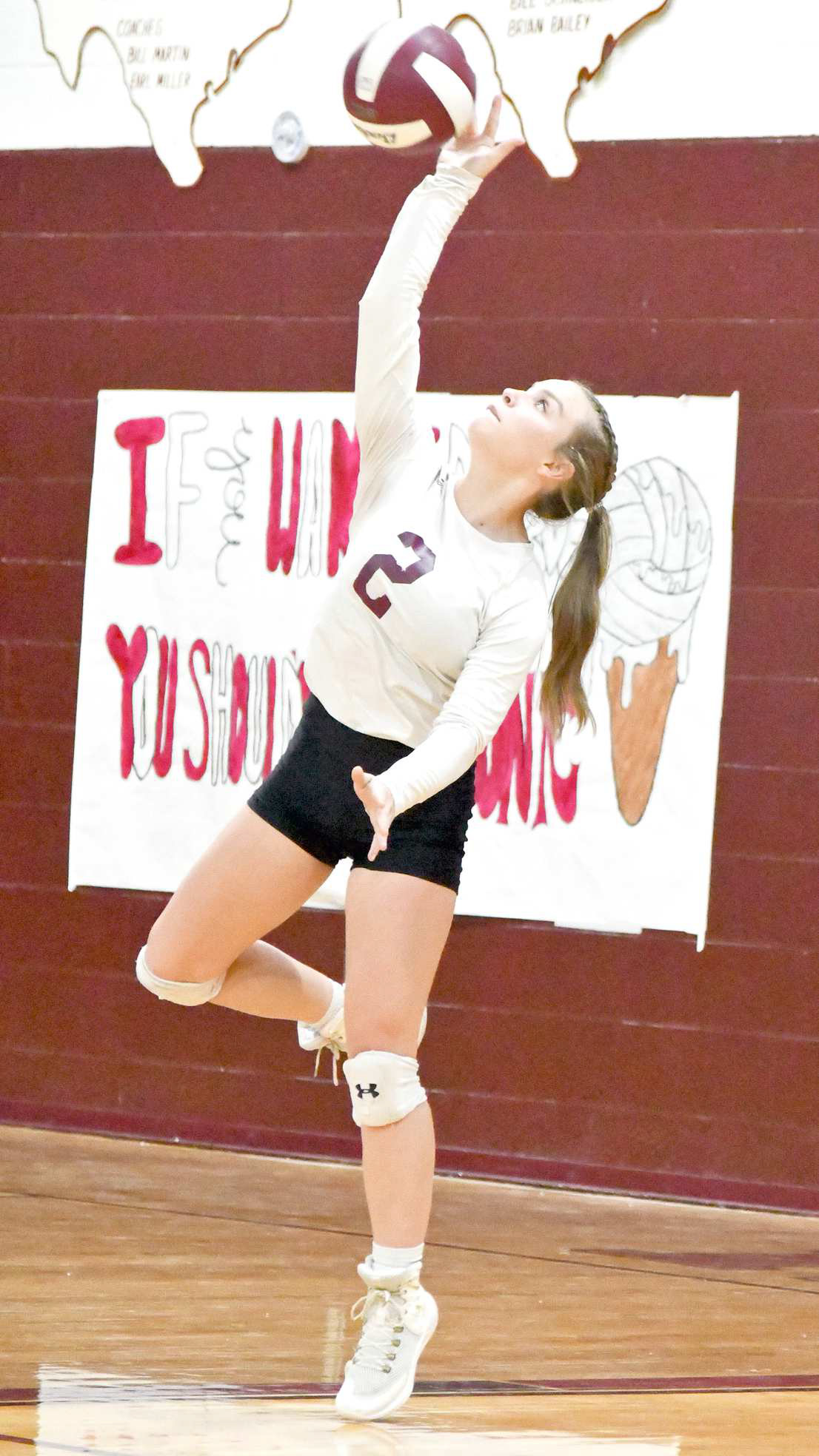 Senior, Kennadi Hanlin, deliveres a serve, during set two, of the Lady Cats, 3-2, victory over Tulia on Tuesday night in district action. (Staff Photo by Derek Lopez)